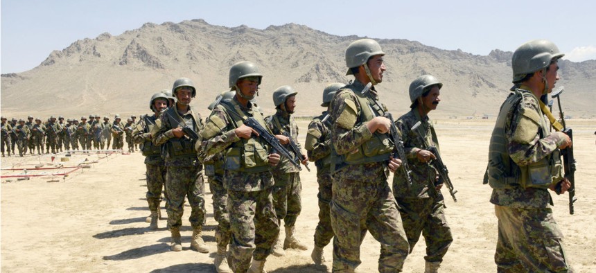 Afghan National Army-Territorial Force members prepare for an exercise at the Kabul Military Training Center in Kabul, Afghanistan, last June.