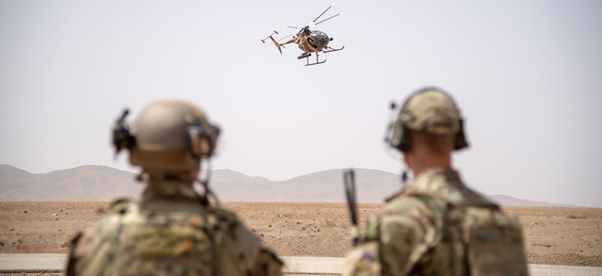 Train, Advise and Assist Command-Air operations advisors observe an MD-530 during the final exercise of the Afghan Tactical Air Coordinator course in Kabul in 2018.