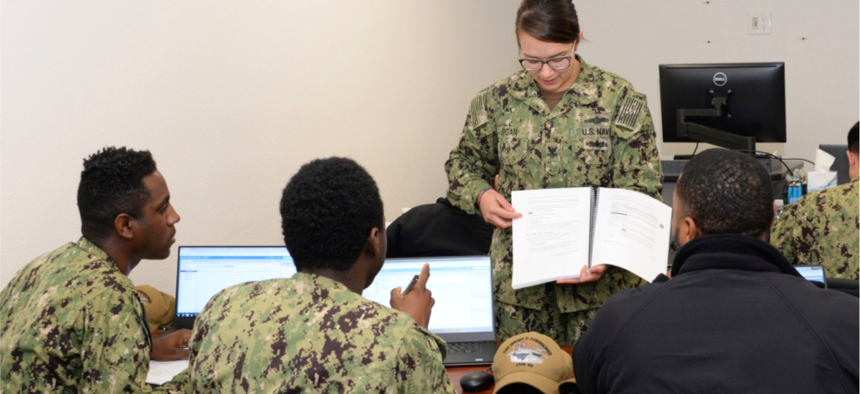 Electronics Technician 2nd Class Makayla Burgan, Security Plus Lead Instructor teaches fleet students VMWare software applications for the shipboard Consolidated Afloat Network Enterprise Services (CANES) system.