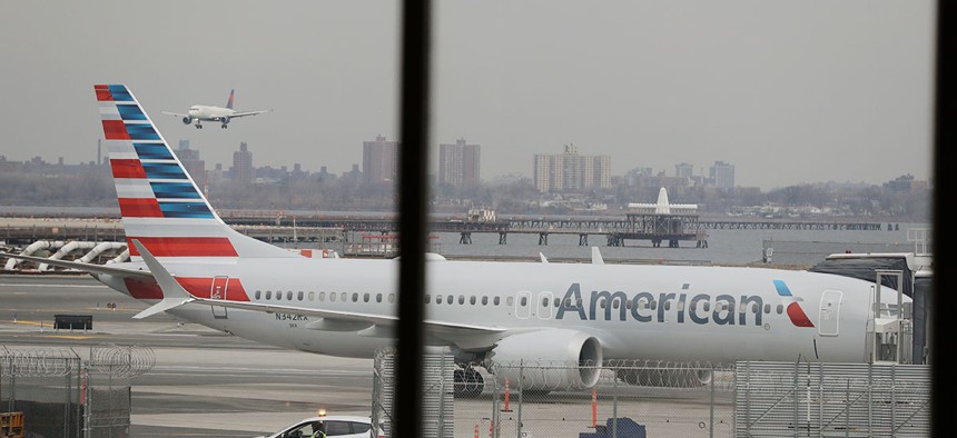 An American Airlines Boeing 737 MAX 8 sits at a boarding gate at LaGuardia Airport Wednesday.