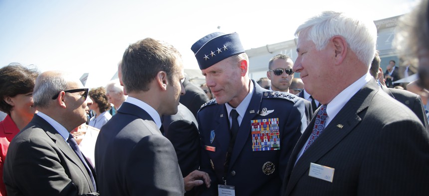 French President Emmanuel Macron, meets with Gen Tod D. Wolters, commander of the US Air Forces in Europe, 2nd right, while visiting the Paris Air Show in Le Bourget, north of Paris, Monday, June 19, 2017.