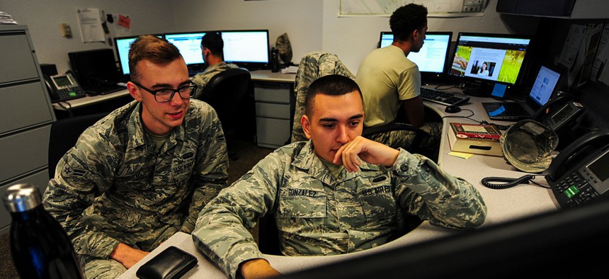 U.S. Air Force cyber security technicians with the 355th Communications Squadron review work orders at Davis-Monthan Air Force Base Ariz. in September.