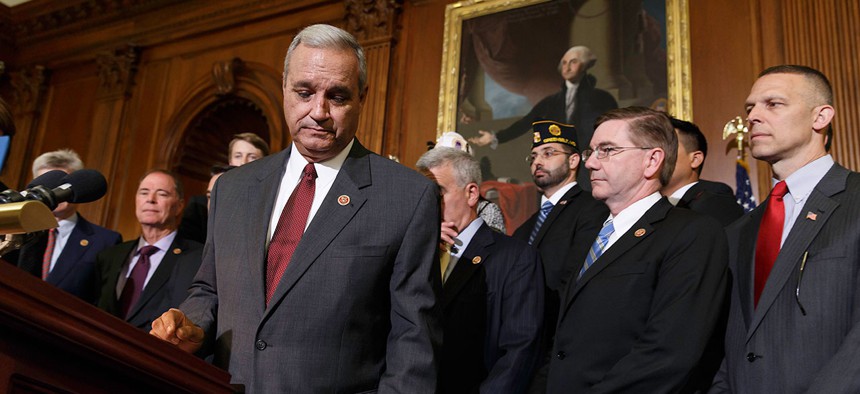 Rep. Jeff Miller (foreground), R-Fla., is shown after calling for reforms in the wake of gross mismanagement and misconduct at VA hospitals in May 2014.