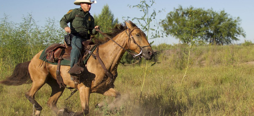 A Border Patrol agent from the McAllen station patrols on horseback in South Texas. 