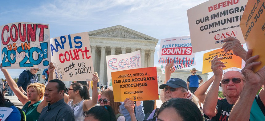 Immigration activists rally outside the Supreme Court on Tuesday.