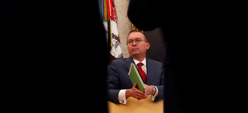 Mulvaney listens to Trump speak at the White House in January.