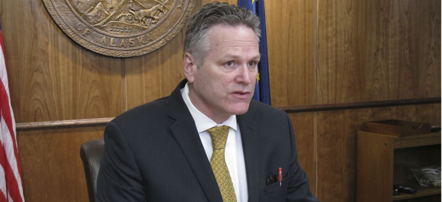 Alaska Gov. Mike Dunleavy speaks to reporters during a news conference on Tuesday, April 9, 2019, in Juneau, Alaska.