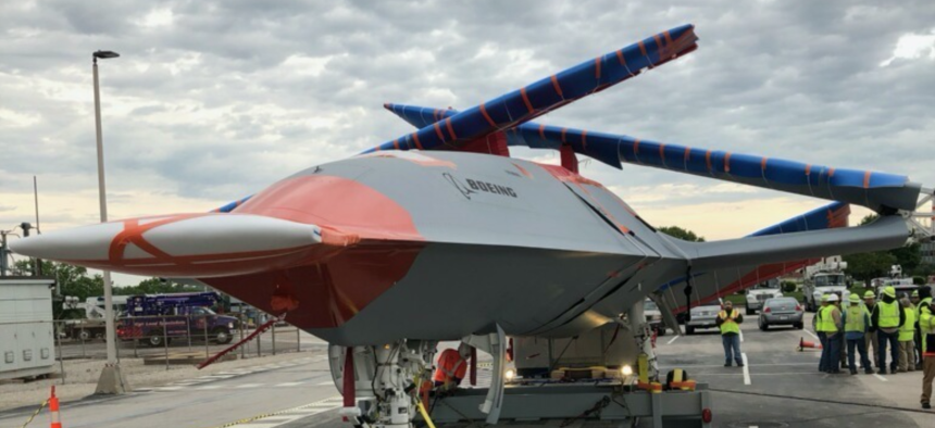 A prototype of the Navy’s new MQ-25 carrier-based drone is driven to its test airfield in Illinois.