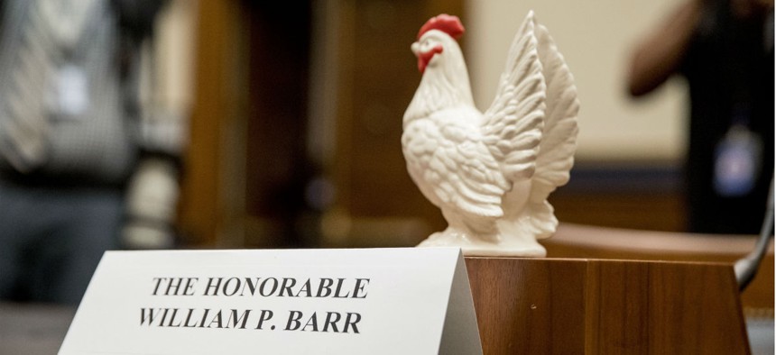Rep. Steve Cohen, D-Tenn., places a prop chicken on the witness desk for Attorney General William Barr after he fails to appear before a House Judiciary Committee hearing Thursday. 