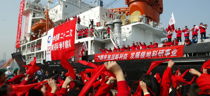 Students waves to members of the Chinese Antarctica Research Team aboard the polar expedition ship Xuelong as they leave Shanghai in east China Friday, Nov. 18, 2005.