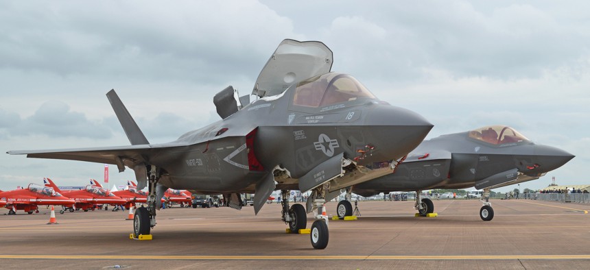 A Marine Corps F-35B sits in front of a US Air Force F-25A at the 2016 Royal International Air Tattoo, Fairford, UK.