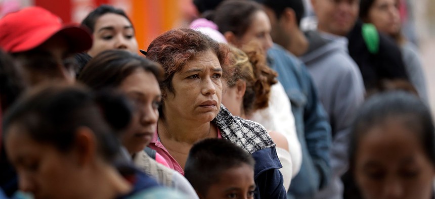 Asylum seekers, lining up in Tijuana in 2018.