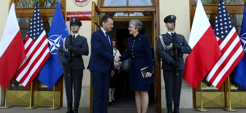 Air Force Secretary Heather Wilson greets Polish Defense Minister Mariusz Blaszczak in Warsaw.