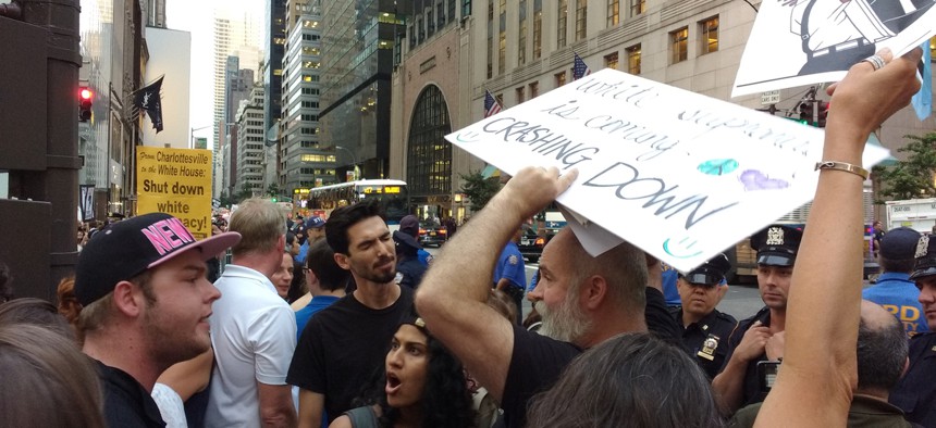 Rally attendees argue in New York in 2018 before Donald Trump's arrival at Trump Tower.