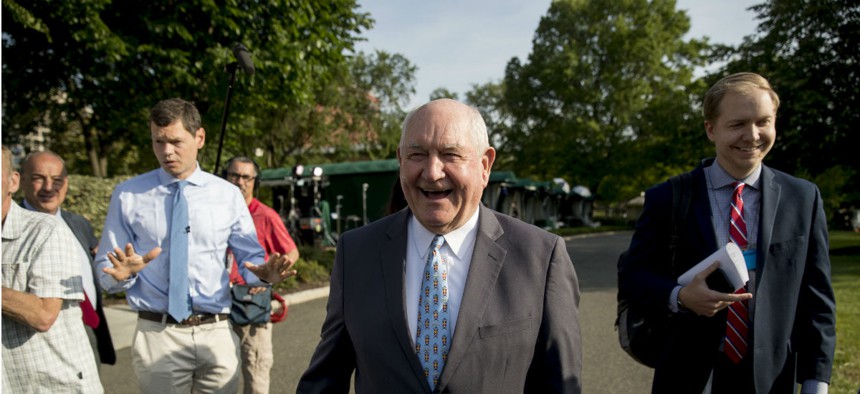 Agriculture Secretary Sonny Perdue talks with reporters on the North Lawn of the White House on May 23.