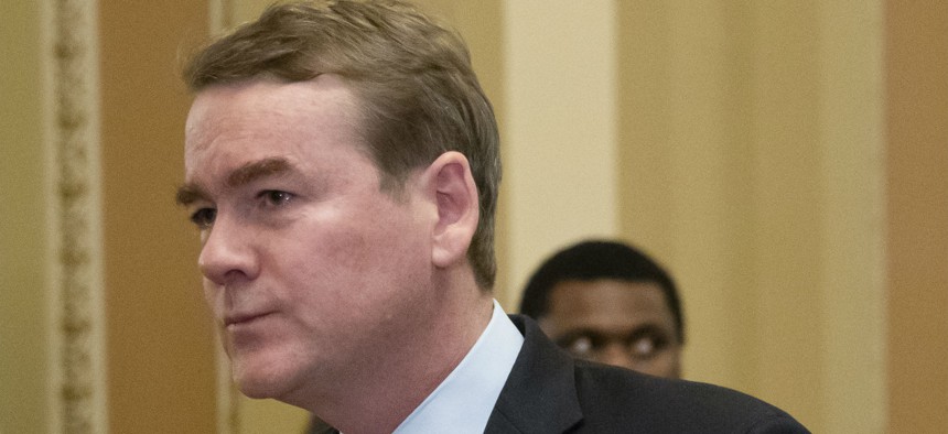 Sen. Michael Bennet, D-Colo., leaves the chamber after an emotional speech on the Senate floor in January.