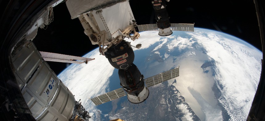 e Northrop Grumman Cygnus space freighter, the Soyuz MS-12 crew ship and the Progress 72 cargo craft are pictured attached to the International Space Station as the orbiting complex flew 258 miles above the Gulf of St. Lawrence.