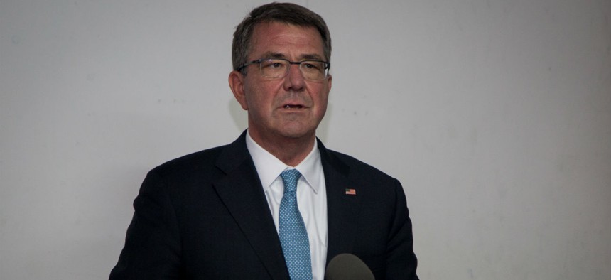 Carter speaks to the press in Iraq in 2016.