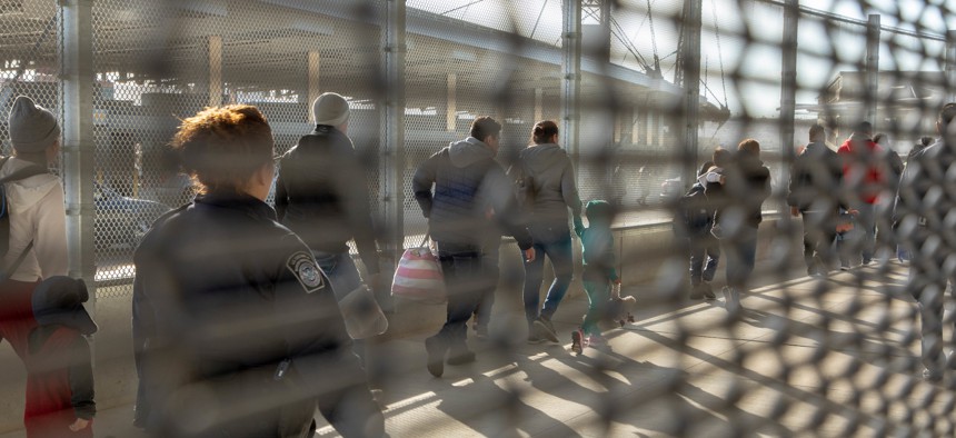 Migrants are processed by CBP at the San Ysidro Port of Entry in 2018.