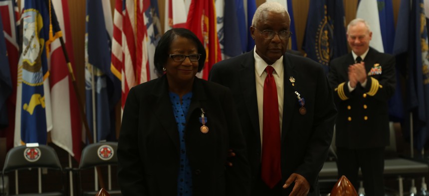Georgia Applewhite, left, and her husband Raymond Applewhite, right, depart their retirement ceremony at Naval Hospital Camp Lejeune in 2016. They retired after a combined federal service of more than 70 years.