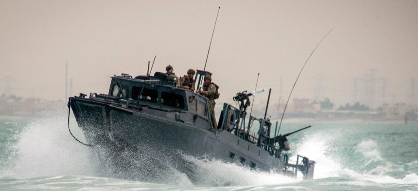 A riverine command boat navigates rough seas during patrol operations in the Persian Gulf on Oct. 30, 2015. Iran was holding 10 U.S. Navy sailors and their two boats, similar to the one pictured here, on Farsi Island on Jan. 12, 2016.