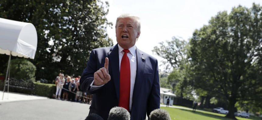 President Donald Trump talks to reporters on the South Lawn of the White House before departing for his Bedminster, N.J. golf club on Friday, July 5.