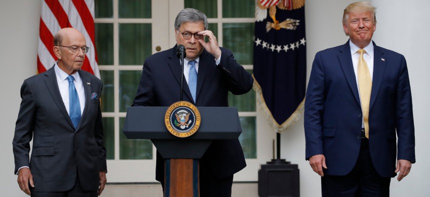 Attorney General William Barr speaks as President Donald Trump and Commerce Secretary Wilbur Ross listen as he speak about the census in the Rose Garden at the White House in July.