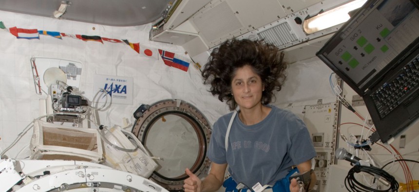 American Astronaut Sunita Williams from Expedition 33 floats next to the J-SSOD containing TechEdSat-1 in 2015.