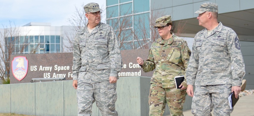 U.S. Air Force Gen. John Hyten, commander of U.S. Strategic Command, left, walks with U.S. Army Col. Kathryn Spletstoser, then director of his commander's action group director at U.S. Army Space and Missile Defense Command in November 2017.