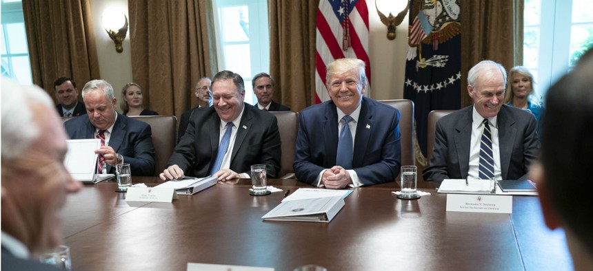 President Trump speaks with reporters during a Cabinet meeting on July 16. Of the record number of vacancies, the president has said he likes to have acting officials as a way of bypassing the confirmation process.