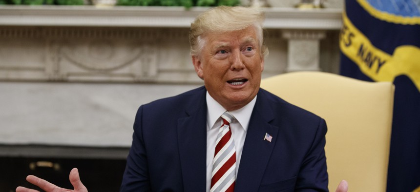 President Donald Trump expresses his desire to reduce U.S. forces in Afghanistan, in the Oval Office of the White House, Tuesday, Aug. 20, 2019, in Washington.