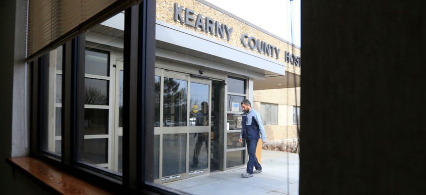A visitor enters Kearny County Hospital in Lakin, Kan., in 2017.
