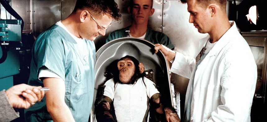 Ham the chimpanzee, with Bill Britz, a veterinarian (right), in the white coat, in 1961.