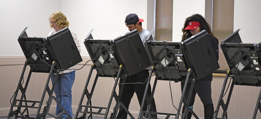 People us voting machines in St. Louis in 2016.