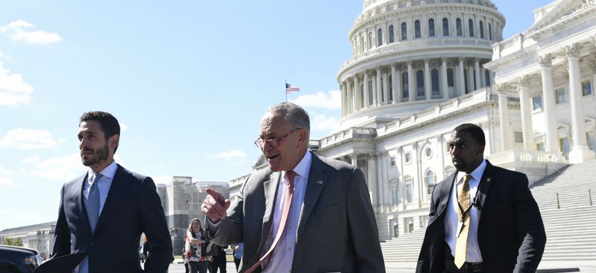 Senate Minority Leader Sen. Chuck Schumer of N.Y., center, walks to a news conference on Capitol Hill in Washington, Tuesday, Sept. 24, 2019, on the impacts of funding of the border wall. 