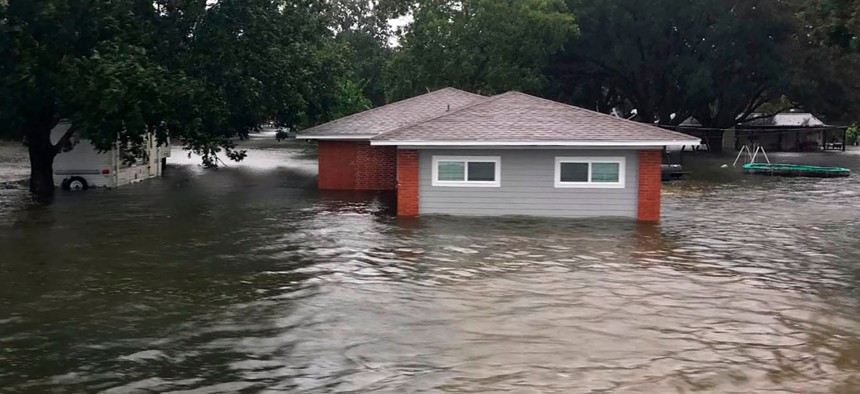 Floodwaters surround a home on Sept 19, 2019, in Winnie, Texas.