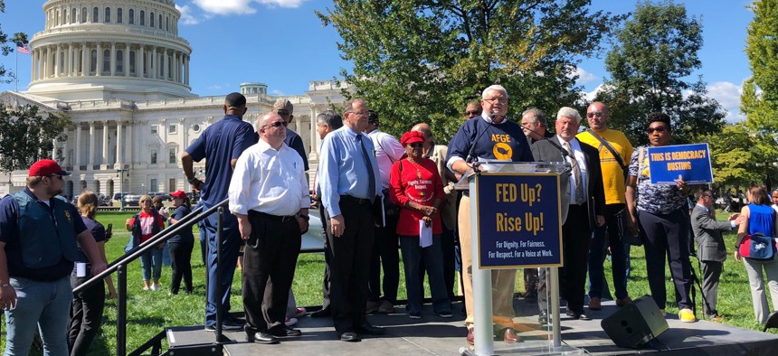 “Any attempts by agencies to enforce these provisions outside of the collective bargaining process will be met with immediate legal challenge by the union,” warned J. David Cox, AFGE’s president. Cox, above, speaks at a union rally in late September.