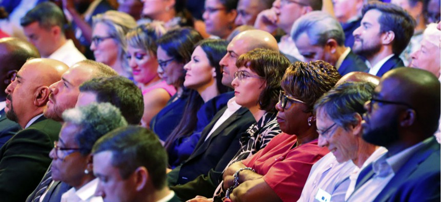 Voters listen during a debate between Democratic candidates for president in Miami on June 26.