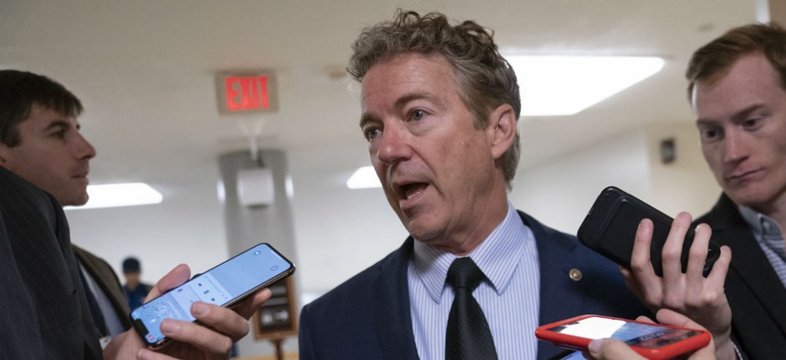 Sen. Rand Paul, R-Ky., speaks with reporters on Wednesday after threatening to reveal the name of the Ukraine whistleblower. 