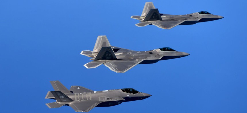 F-22 Raptors from the 94th Fighter Squadron, Joint Base Langley-Eustis, Va., and F-35A Lightning IIs from the 58th Fighter Squadron, Eglin Air Force Base, Fla., fly in formation after completing an integration training mission.