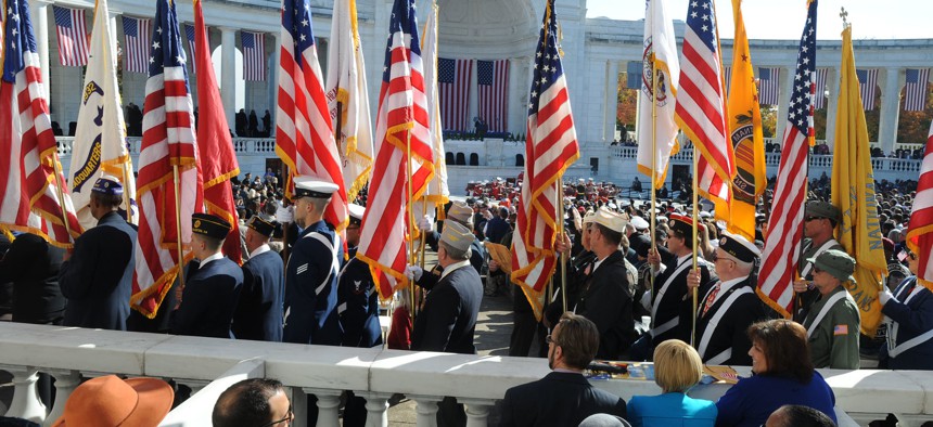 Veterans gather at Arlington Cemetery in 2014 to mark Veterans Day.