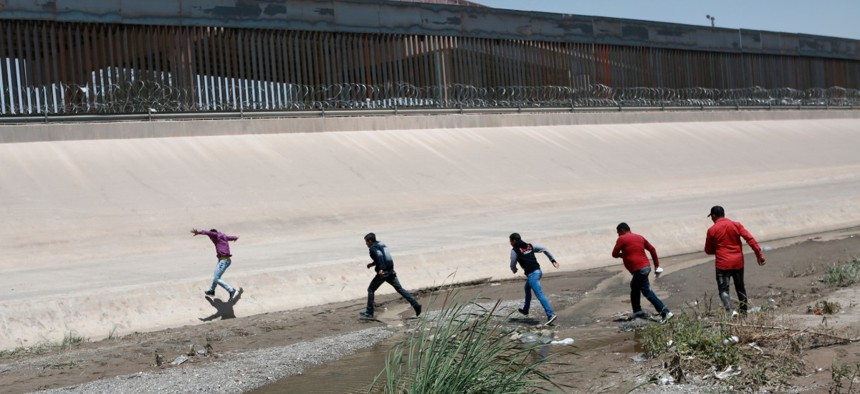 Migrants cross the Rio Bravo in June.