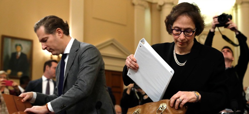 Constitutional law experts, from left, Harvard Law School professor Noah Feldman and Stanford Law School professor Pamela Karlan, arrive to testify during a hearing Wednesday.