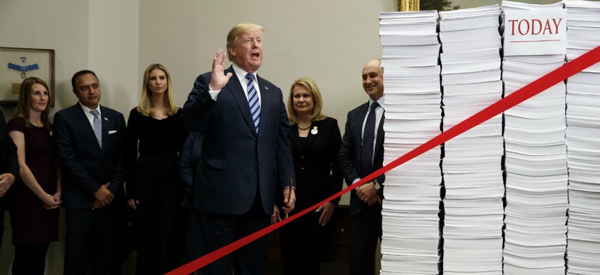 "Let's cut the red tape, let's set free our dreams," Trump said as he symbolically cut a ribbon on stacks of paper representing the size of the regulatory code at an event at the White House in December 2017.