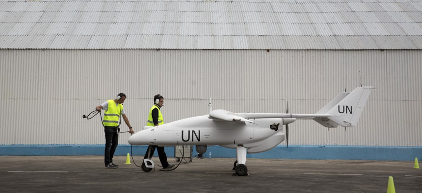  U.N. technicians prepare an unarmed drone for flight over the Democratic Republic of Congo.