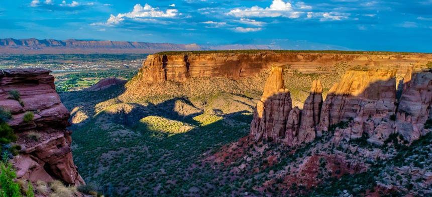 The sun sets on the Colorado National Monument near Grand Junction, Colo., where the BLM headquarters is moving. 