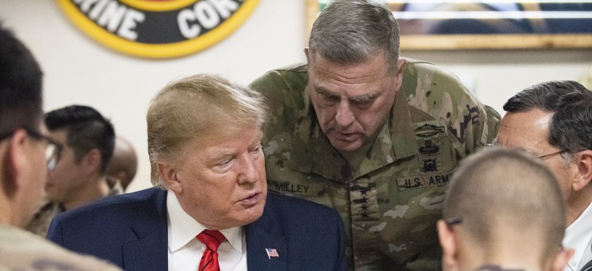President Donald Trump and Gen. Mark Milley, chairman of the Joint Chiefs of Staff, meet with service members at Bagram Airfield in Afghanistan, Nov. 28, 2019. 