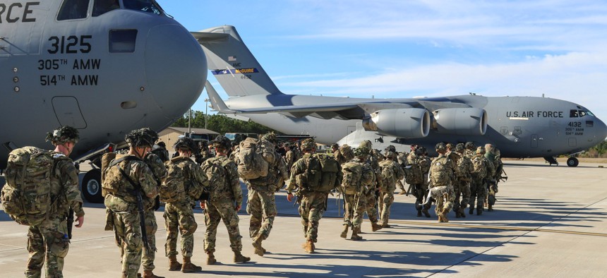 Army paratroopers assigned to the 2nd Battalion, 504th Parachute Infantry Regiment deploy from Pope Army Airfield, N.C., Jan. 1, 2020.