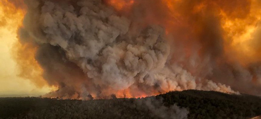 Wildfires rage under plumes of smoke in Bairnsdale, Australia in December.