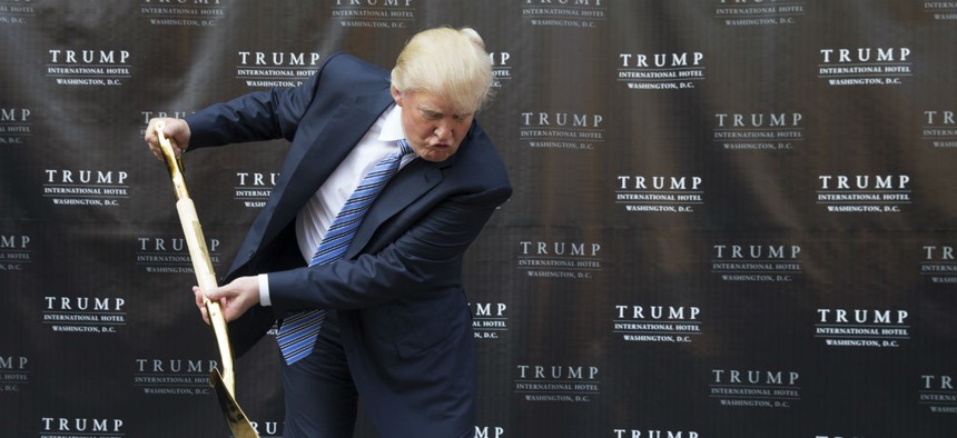 Donald Trump takes part in a ground breaking ceremony for the Trump International Hotel on the site of the Old Post Office, in Washington, Wednesday, July 23, 2014. 